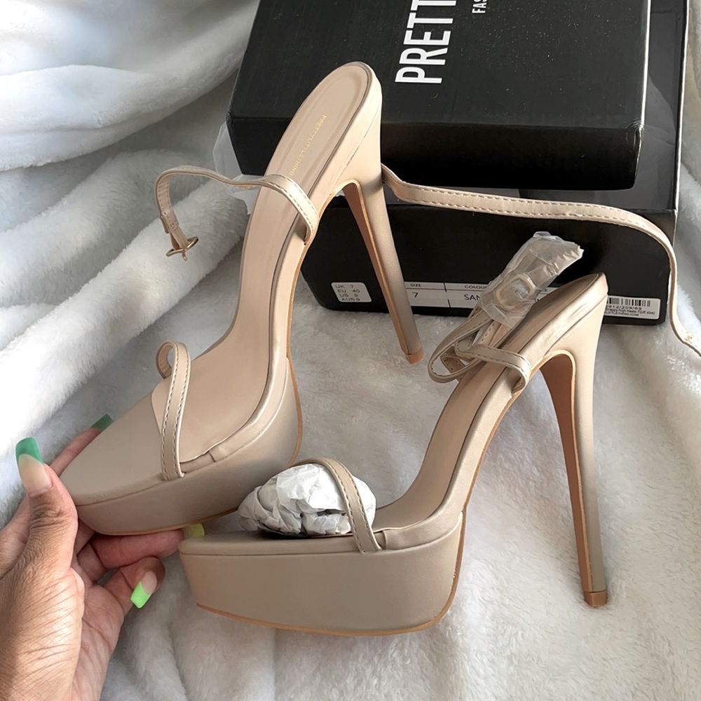 Brand new towering Nude strappy heel